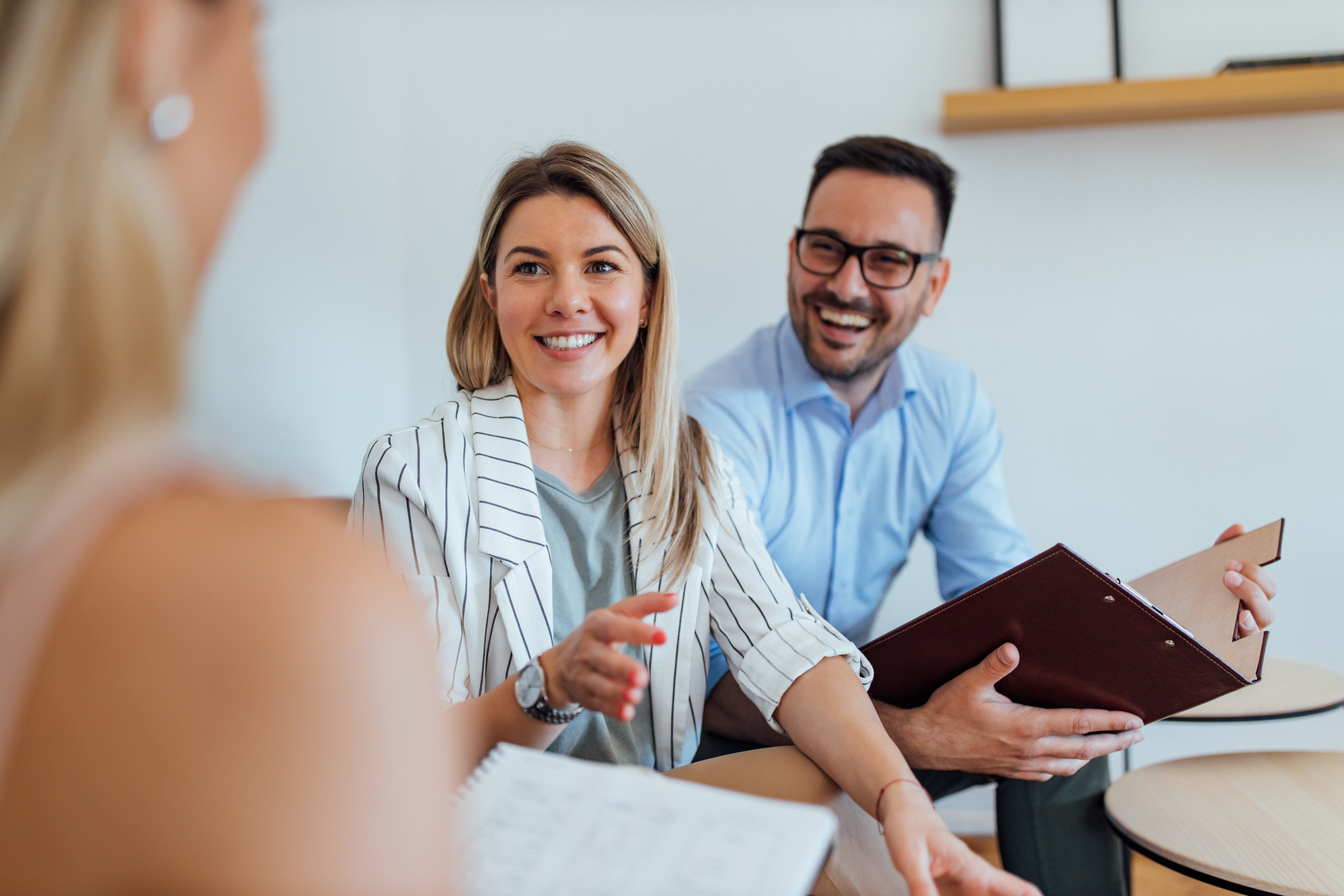 Woman in a boardroom discussing services